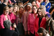 Women Democratic members of Congress wearing pink to protest the Trump administration's policies.