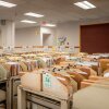 The IRS says it processed 11.7 million tax returns in the first week of the 2025 filing season. Here, carts loaded with documents are seen at an IRS processing facility in Austin, Texas, last September.