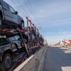 A car carrier trailer drive to cross to the U.S. at Otay Commercial port in Tijuana, Mexico on January 31. President Donald Trump's threatened tariffs on Mexico and Canada, set to go into effect on Tuesday, would hurt the Mexican economy — but also hurt auto plants in the U.S.