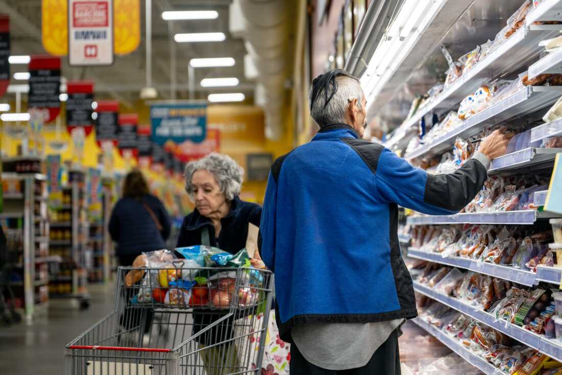 Customers shop for produce at a grocery store in Austin, Texas, on Feb. 12, 2025.