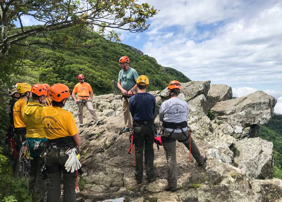 Members of the Shenandoah National park Search and Rescue go over rope techniques as they train on a mountain cliff in Shenandoah National park, Va., on June 13, 2019.