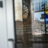 A view through the doors of the U.S. Department of Education, in Washington, D.C., on Wednesday, the day after the agency said it would lay off nearly half its staff. 