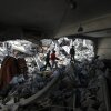 Palestinian children are seen among the rubble of destroyed houses after Israeli attacks in Jenin camp, the northern West Bank, on Feb. 26, 2025. The West Bank is becoming a battlefield, and ordinary Palestinians are the first and most to suffer, a UN official warned on Wednesday. TO GO WITH "West Bank becoming battlefield, UN official warns"