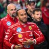 British F1 driver Lewis Hamilton signs autographs during the Scuderia Ferrari HP Drivers' presentation event by Unicredit, in Piazza Castello in Milan, on March 6, 2025. (Photo by Piero CRUCIATTI / AFP) (Photo by PIERO CRUCIATTI/AFP via Getty Images)