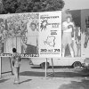 People look at a billboard in Kinshasa on Oct. 30, 1974, announcing the fight between U.S. boxers Muhammad Ali and George Foreman. That day, Ali knocked out Foreman in a clash of titans known as "the Rumble in the Jungle," watched by 60,000 people in the stadium in Kinshasa and millions elsewhere.